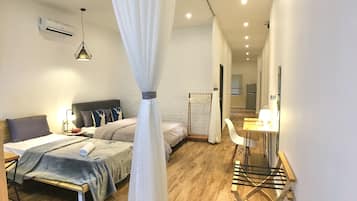 Studio, 2 Bedrooms | Desk, blackout drapes, iron/ironing board, free WiFi