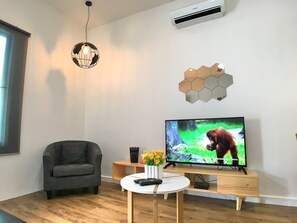 Studio, 2 Bedrooms | Living area | Flat-screen TV - iBook 5 - Scandinavian Suites Room (George Town)
