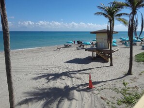 On the beach, sun loungers, beach towels