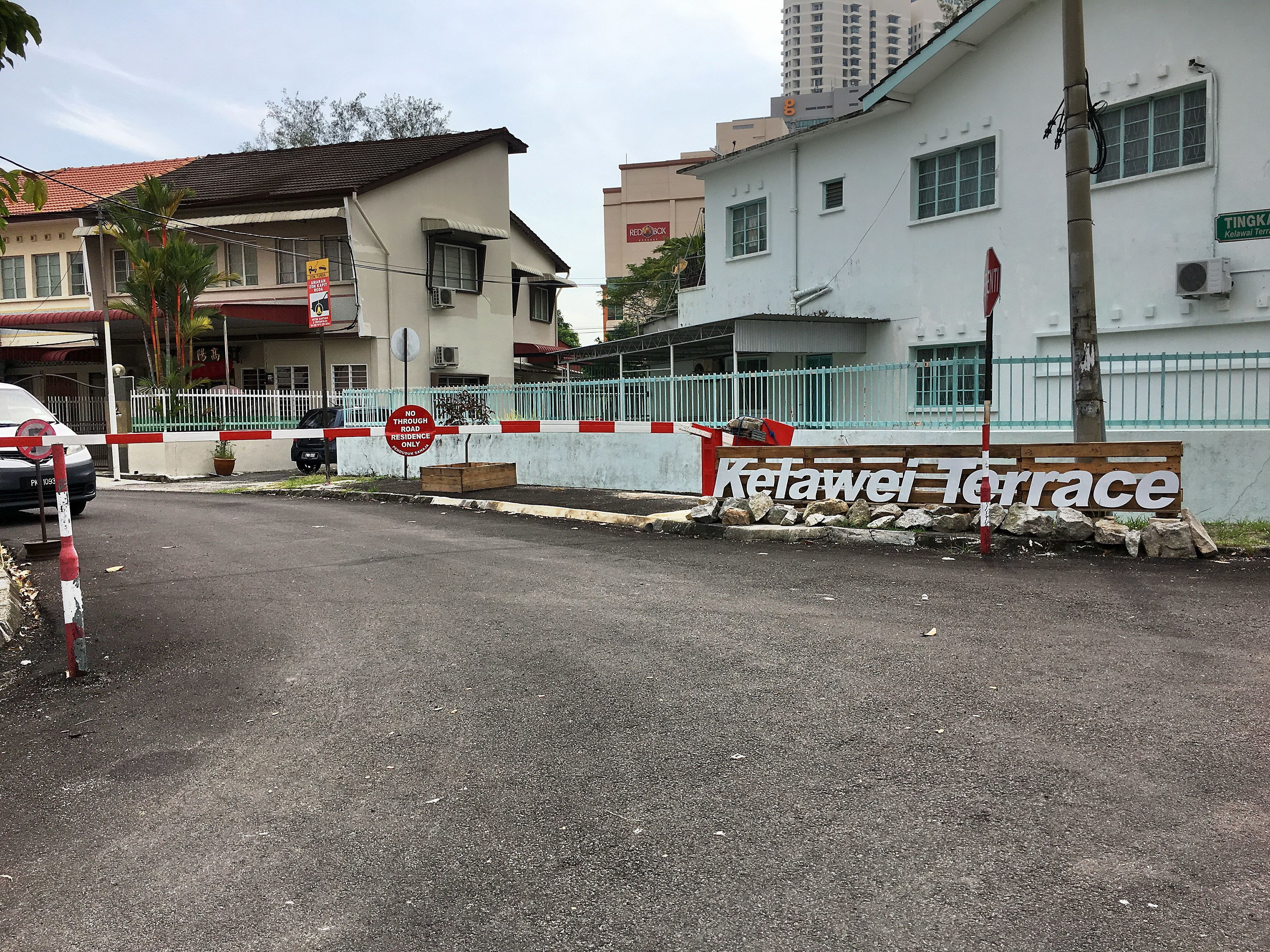 A gated entrance with a sign reading "No Through Road Access Only."