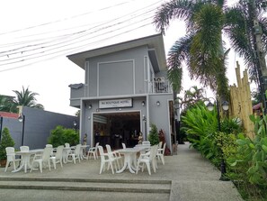 A two-story building with a sign reading "MJ Boutique Hotel". - MJ Boutique Hotel Khao Lak (Thai Mueang)