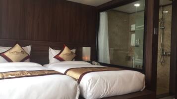 Premium bedding, down comforters, pillowtop beds, minibar