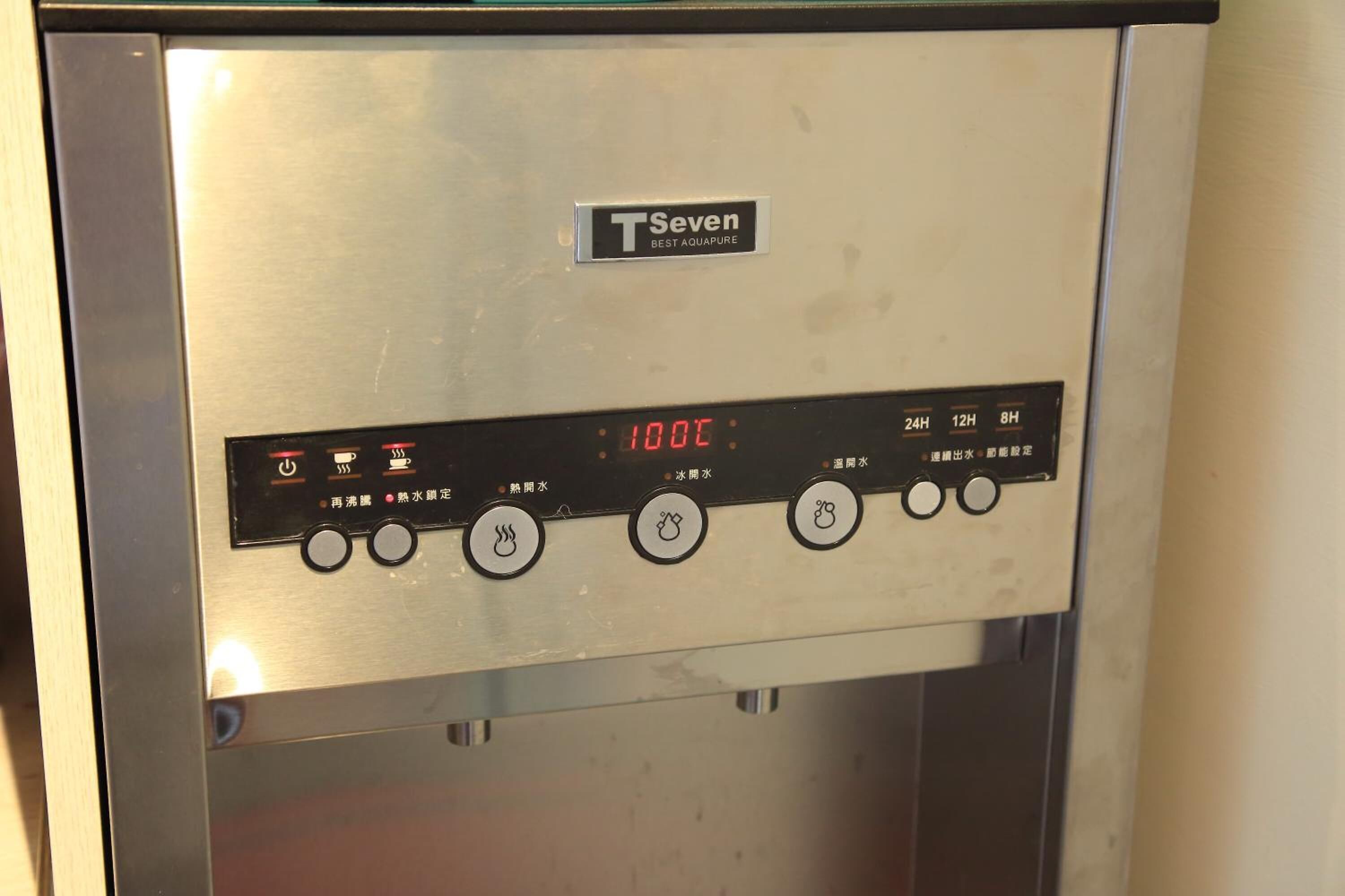 A control panel with a digital display reading "1000" and various buttons for settings.