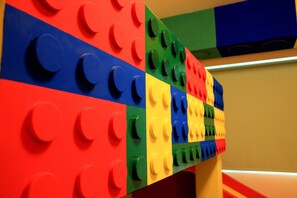 A colorful LEGO wall with various colors and circular studs.
