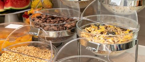 A buffet with various food items in clear containers.