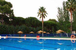 Seasonal outdoor pool, pool umbrellas