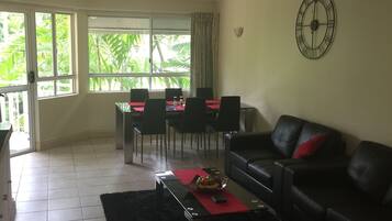 Family Apartment, 3 Bedrooms | Living room | Flat-screen TV