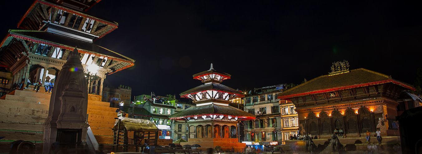 A traditional building with a central dome and multiple smaller structures around it.