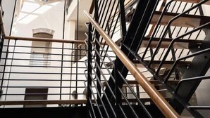 A multi-level building with a glass ceiling and metal railings. - Avemore Jan Cats No 2 (Stellenbosch)