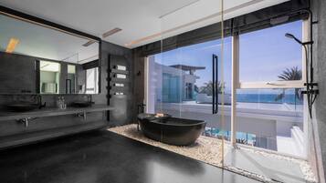 Separate bathtub and shower, deep-soaking bathtub, rainfall showerhead