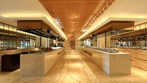 A spacious hotel lobby with a marble floor, wooden ceiling, and glass partitions. - Lanxi International Hotel  (Xi'an)