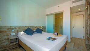 A bedroom with a bed, bedside table, and a nightstand. - AGI Gloria Rooms (Roses)