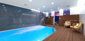 Indoor pool, open 1:00 PM to 9:30 PM, pool loungers