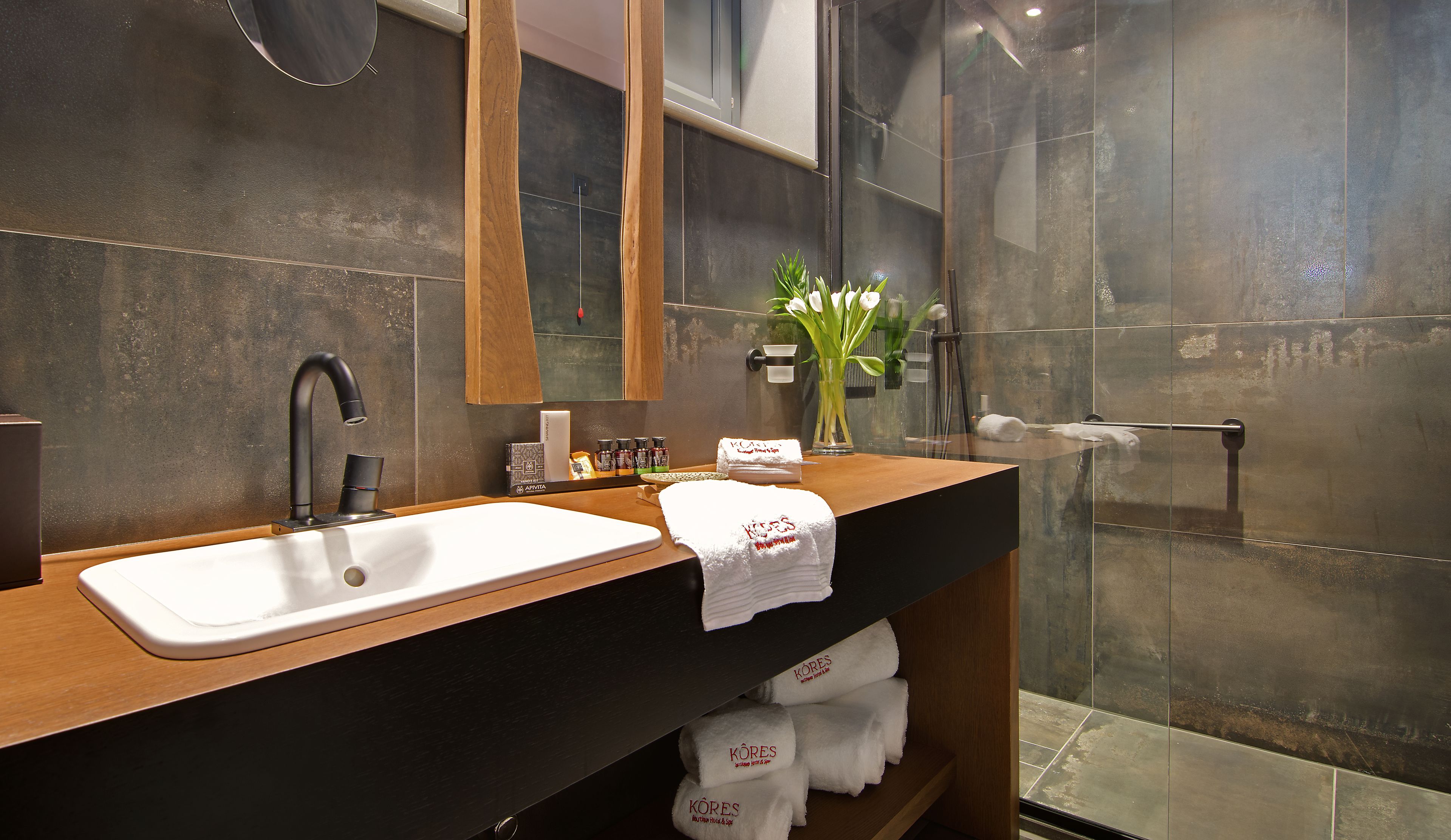 family studio suite, multiple beds | bathroom | shower, hydromassage showerhead, designer toiletries, hair dryer