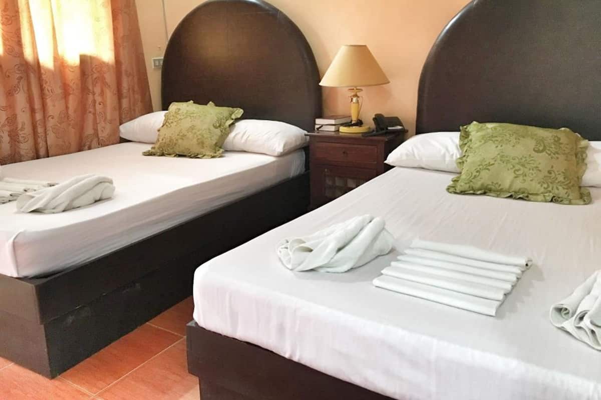 Family Room | Desk, iron/ironing board, bed sheets