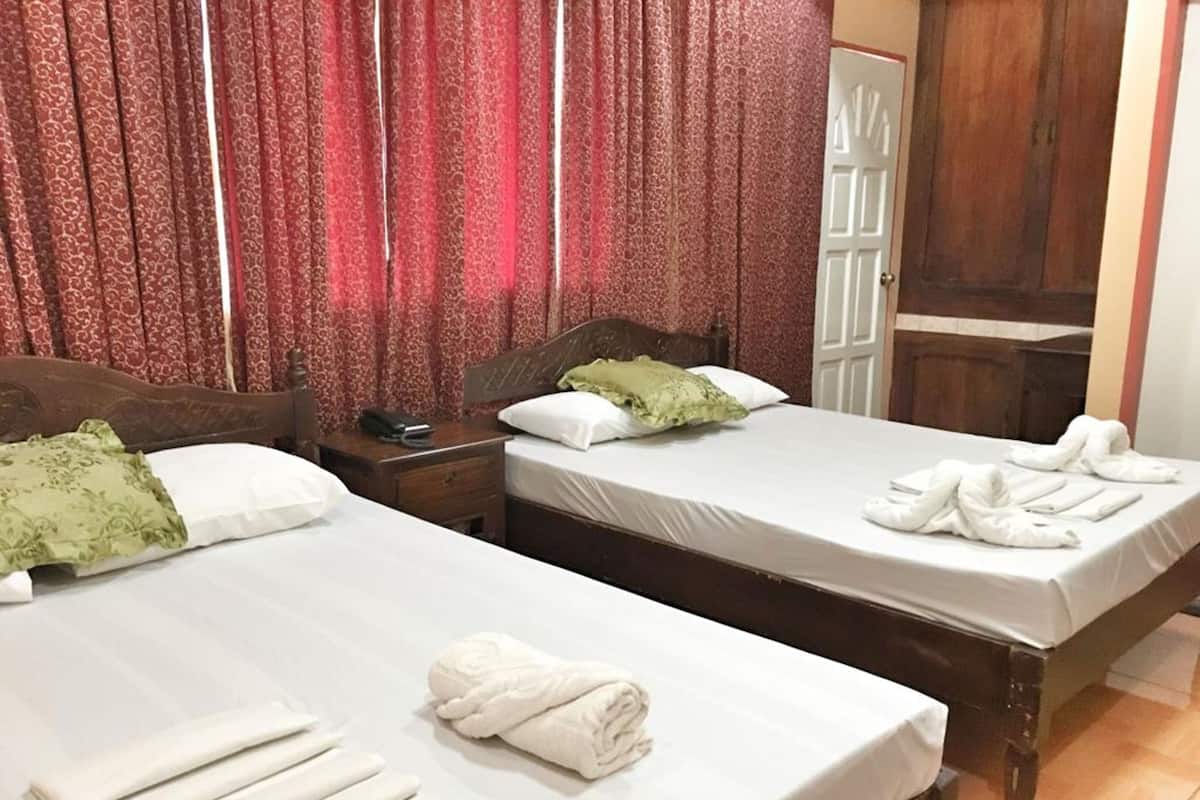 Desk, iron/ironing board, bed sheets