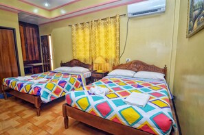 Family Room | Desk, iron/ironing board, bed sheets - Gertes Resort & Hotel (Laoag)