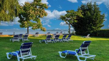 Sun-loungers, beach umbrellas, beach volleyball