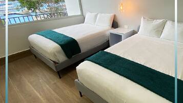 Deluxe Double Room, Balcony, Ocean View | Pillow-top beds, blackout curtains, iron/ironing board, free WiFi