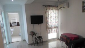 Apartment, 2 Bedrooms | Living room | 32-inch LCD TV with satellite channels, TV - Résidence Bloc C (Hammamet)