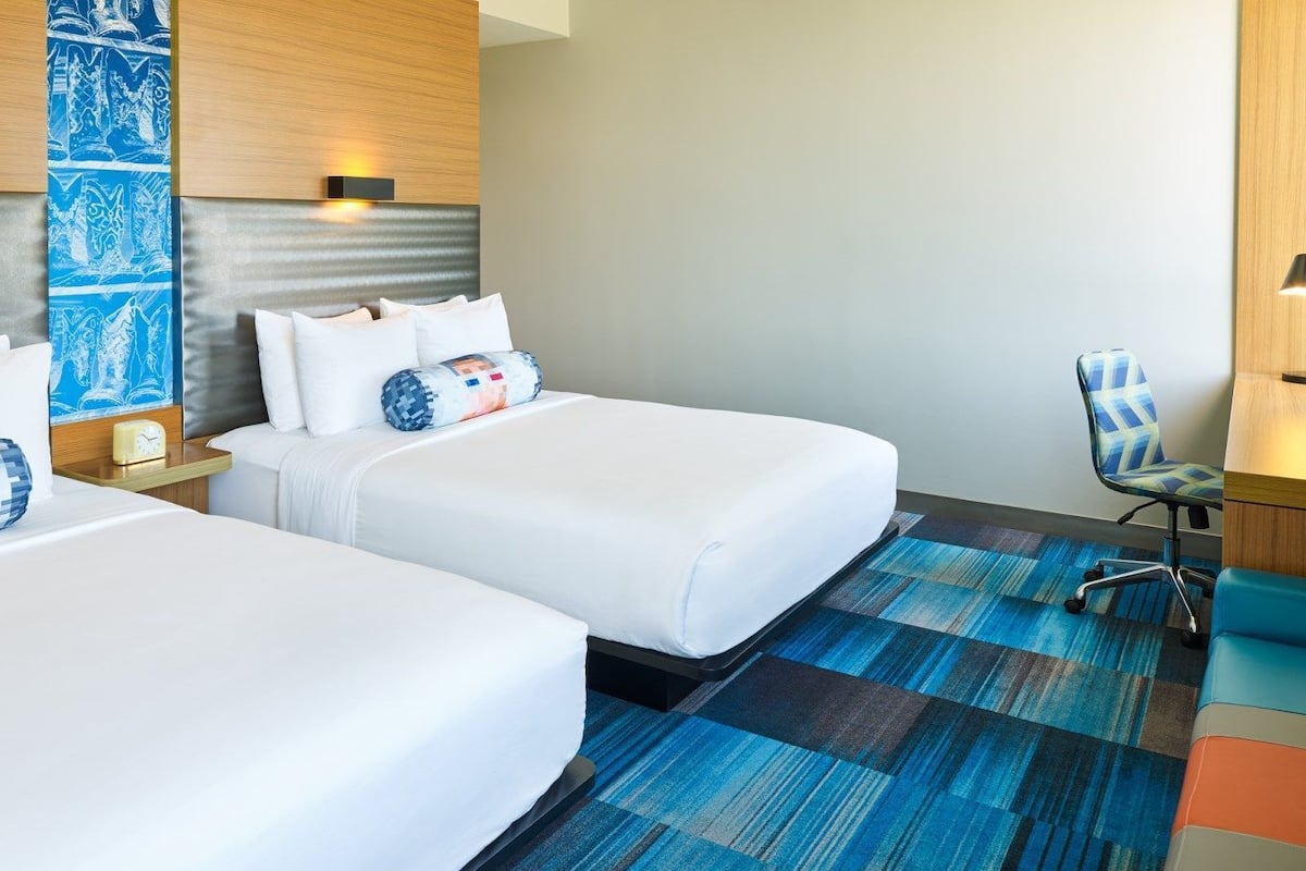 Hypo-allergenic bedding, down comforters, in-room safe, desk