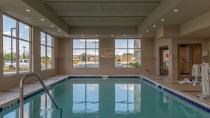 An indoor swimming pool with clear signage, a lifeguard station, and a view of the outside. - Hampton Inn Bourbonnais Kankakee (Bourbonnais)