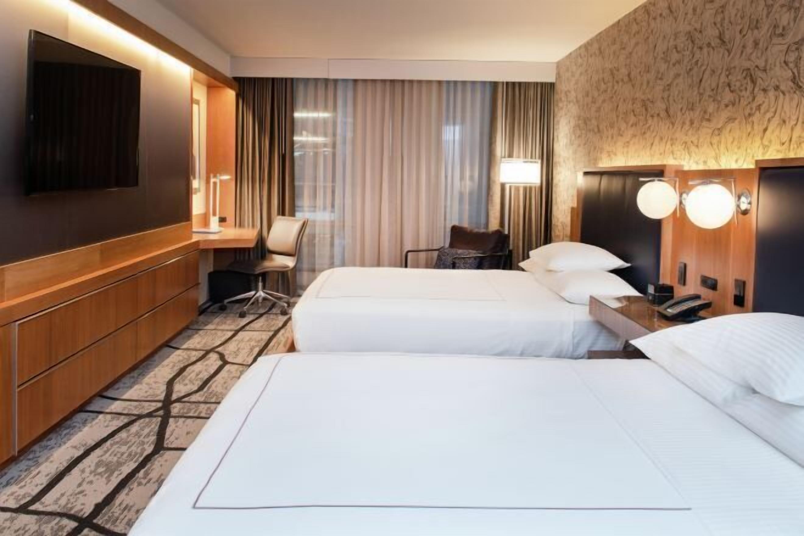 Premium bedding, down duvets, in-room safe, desk