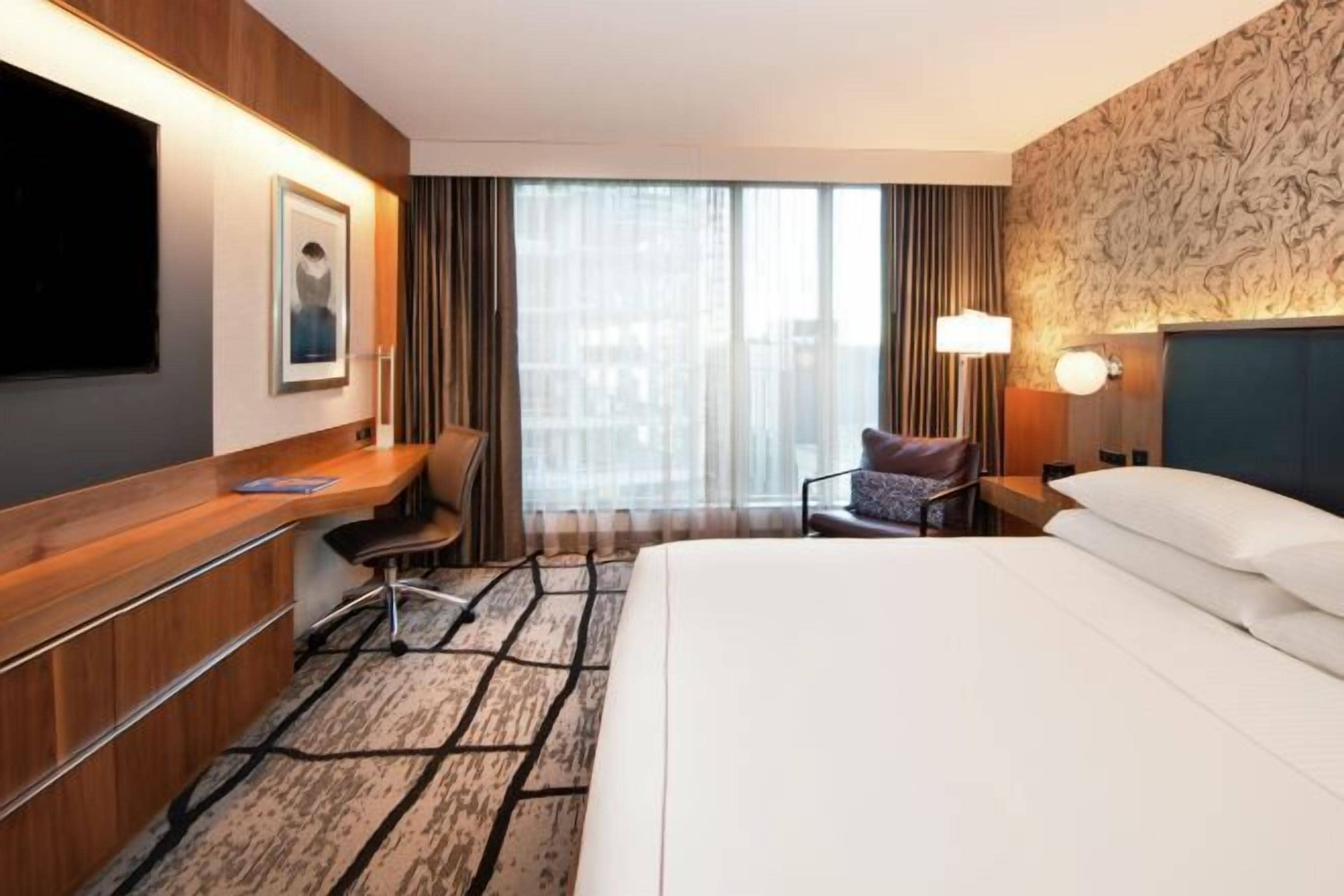 Premium bedding, down duvets, in-room safe, desk