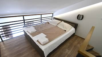 Loft, cozinha | Frigobar, escrivaninha, quartos à prova de som, Wi-Fi de cortesia