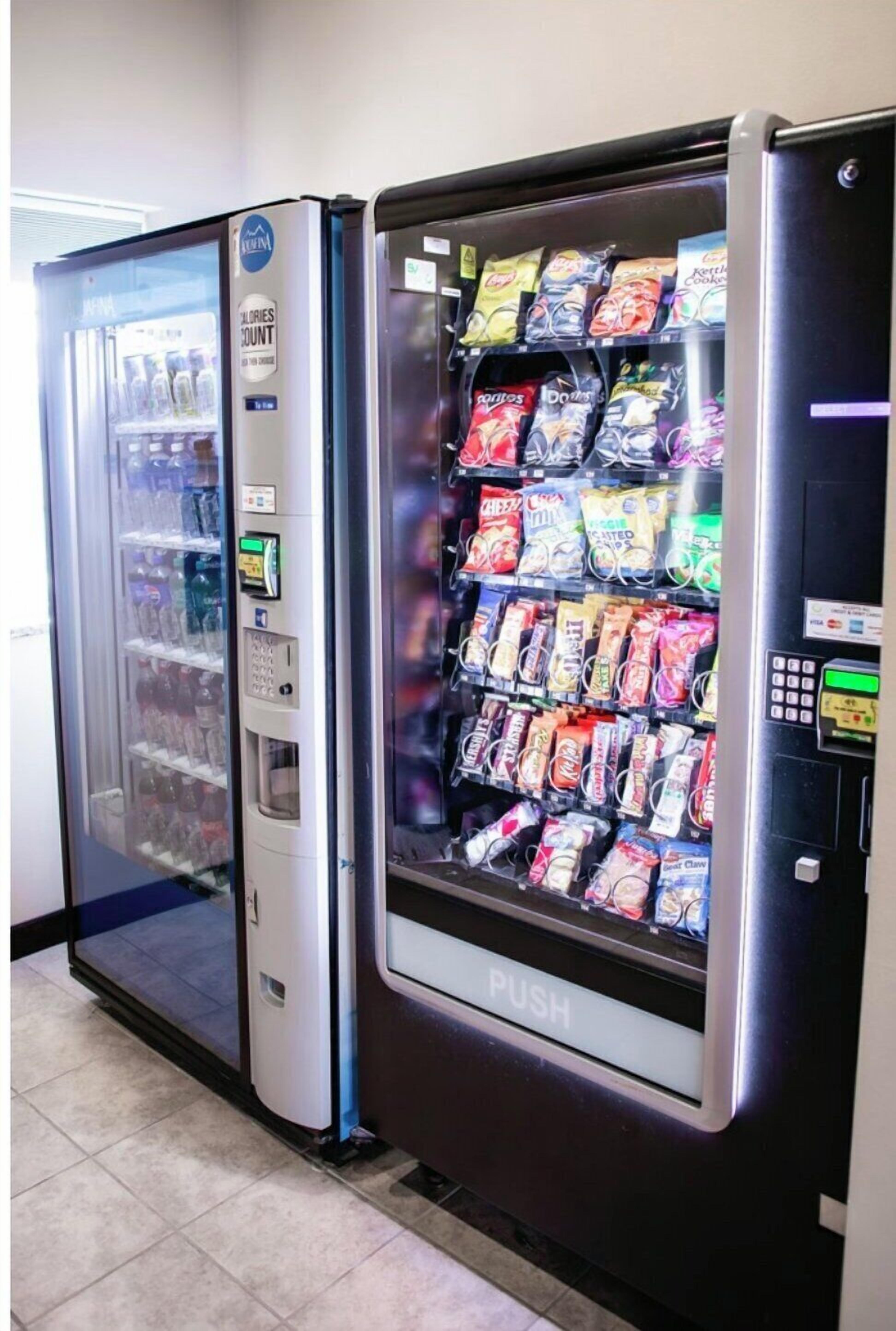 A vending machine with snacks and a drink dispenser.