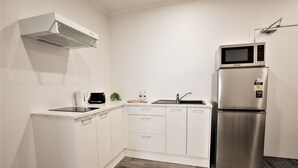 Traditional Apartment, 2 Bedrooms, Private Bathroom, Ground Floor | Private kitchen | Coffee/tea maker, full-size fridge, microwave, oven - Holiday Rotorua (Rotorua)