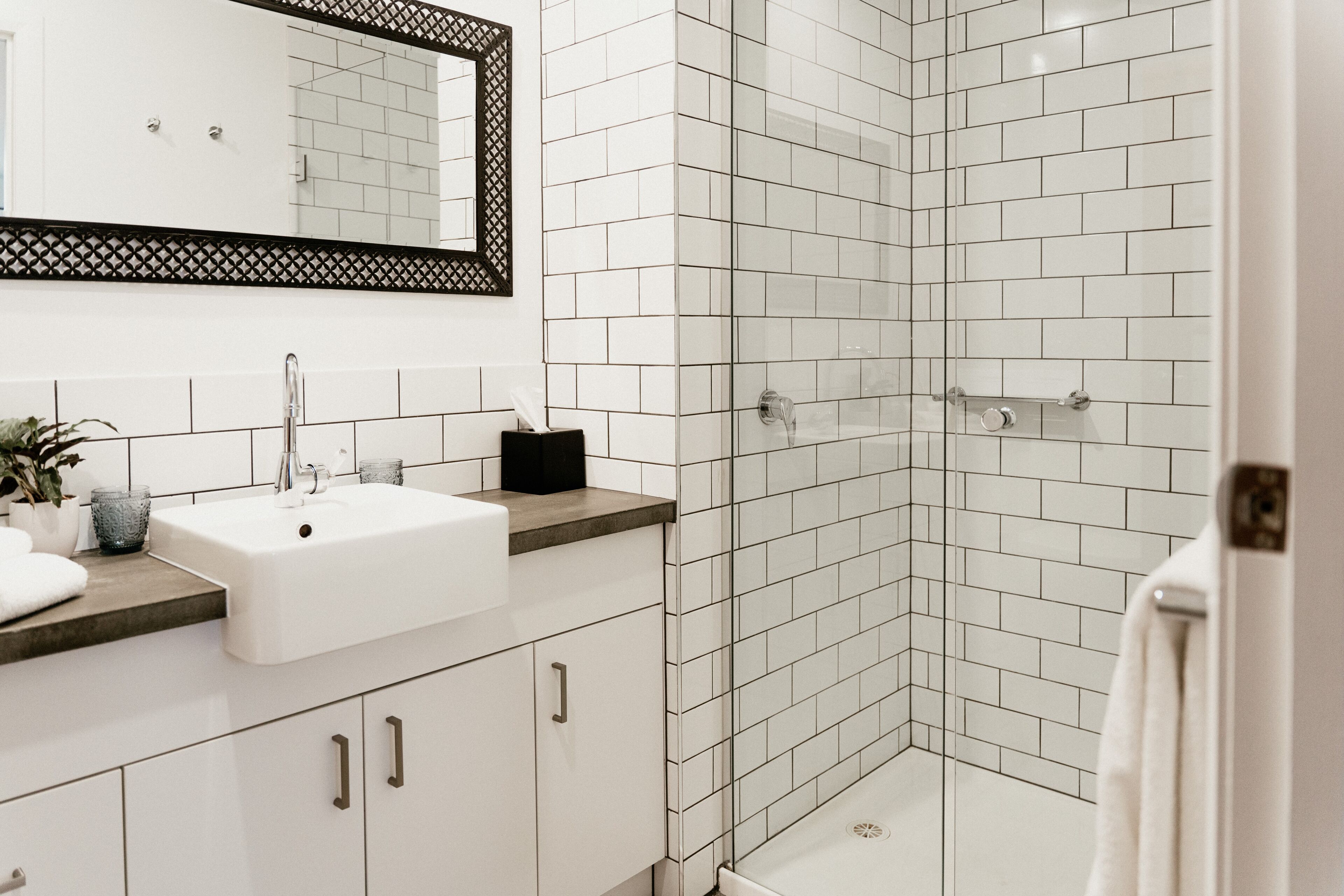 motel suites | bathroom | shower, rainfall showerhead, designer toiletries, hair dryer