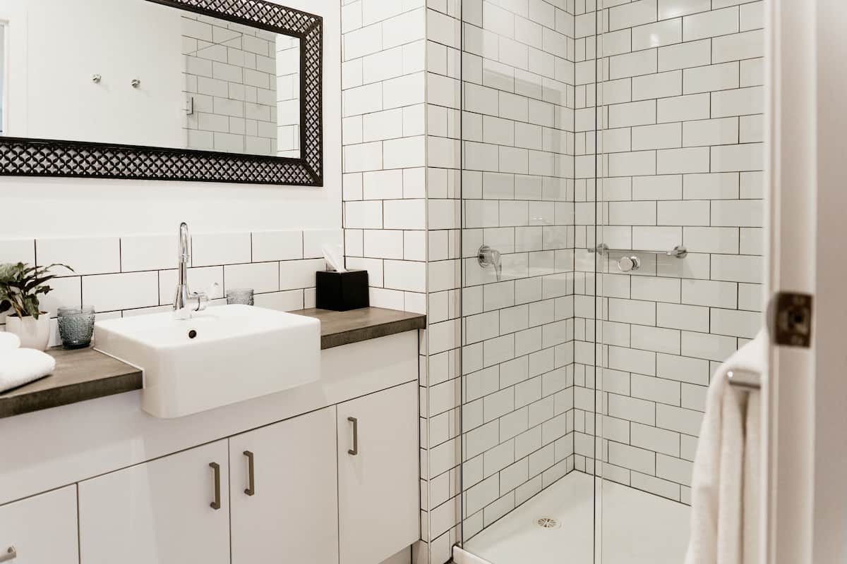 motel suites | bathroom | shower, rainfall showerhead, designer toiletries, hair dryer