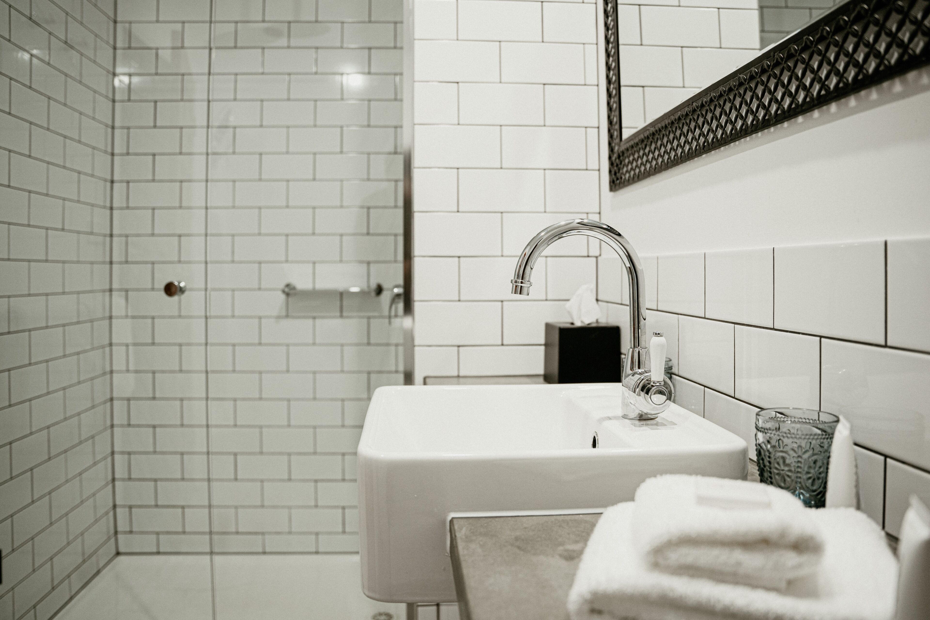 motel suites | bathroom | shower, rainfall showerhead, designer toiletries, hair dryer