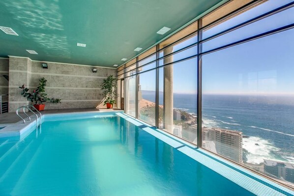 Indoor pool, outdoor pool, pool umbrellas, sun loungers