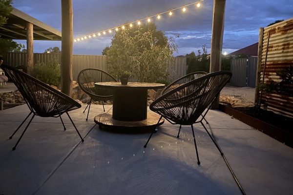 Undercover seating area in back yard.