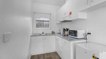 Fridge, microwave, stovetop, cookware/dishes/utensils