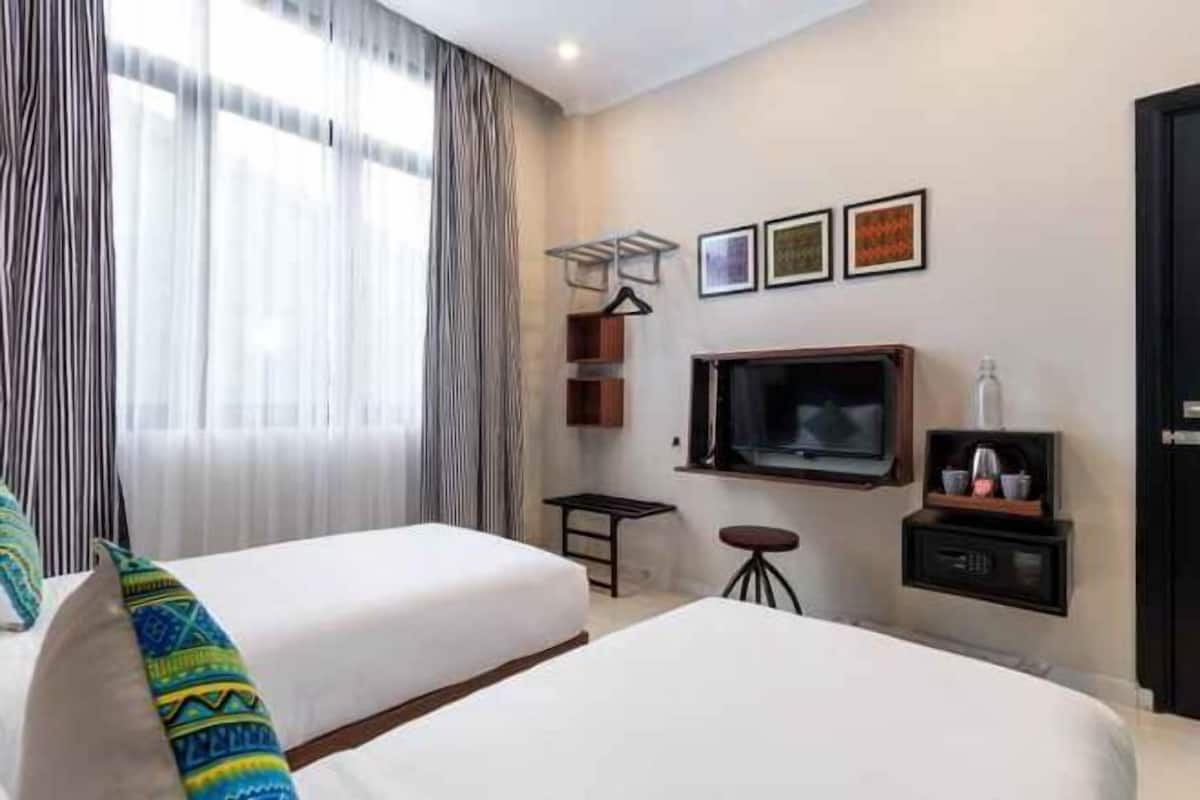 Ropa de cama de alta calidad, minibar, caja fuerte y escritorio