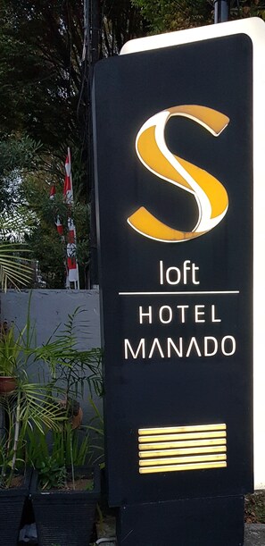 A sign for the Loft Hotel Manado with a large illuminated 'S' logo. - S Loft Manado (Manado)