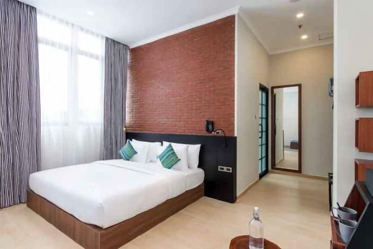 Roupas de cama premium, frigobar, cofres nos quartos, escrivaninha