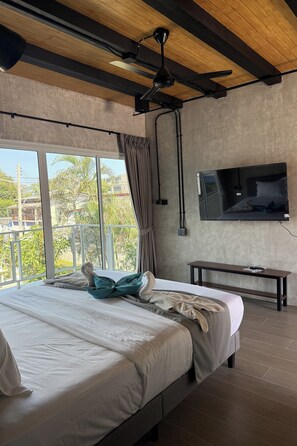 Deluxe Room | Minibar, in-room safe, individually decorated, individually furnished