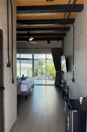 Habitación Deluxe | Minibar, caja de seguridad en la habitación y decoración personalizada 