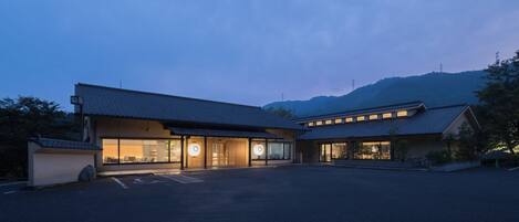 A traditional building with a large entrance and a covered walkway.