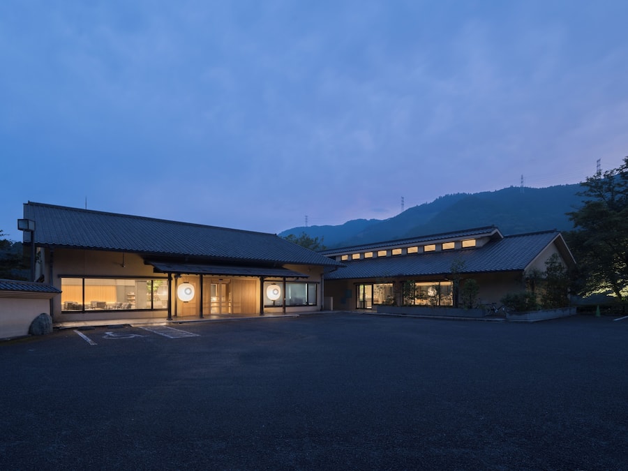 A traditional building with a large entrance and a covered walkway.