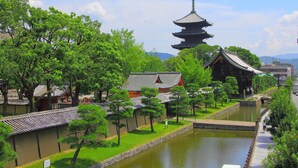 A traditional Japanese temple with a multi-tiered pagoda, surrounded by a moat and lush greenery. - Terrace Kiyomizu Kyoto (Kyoto)