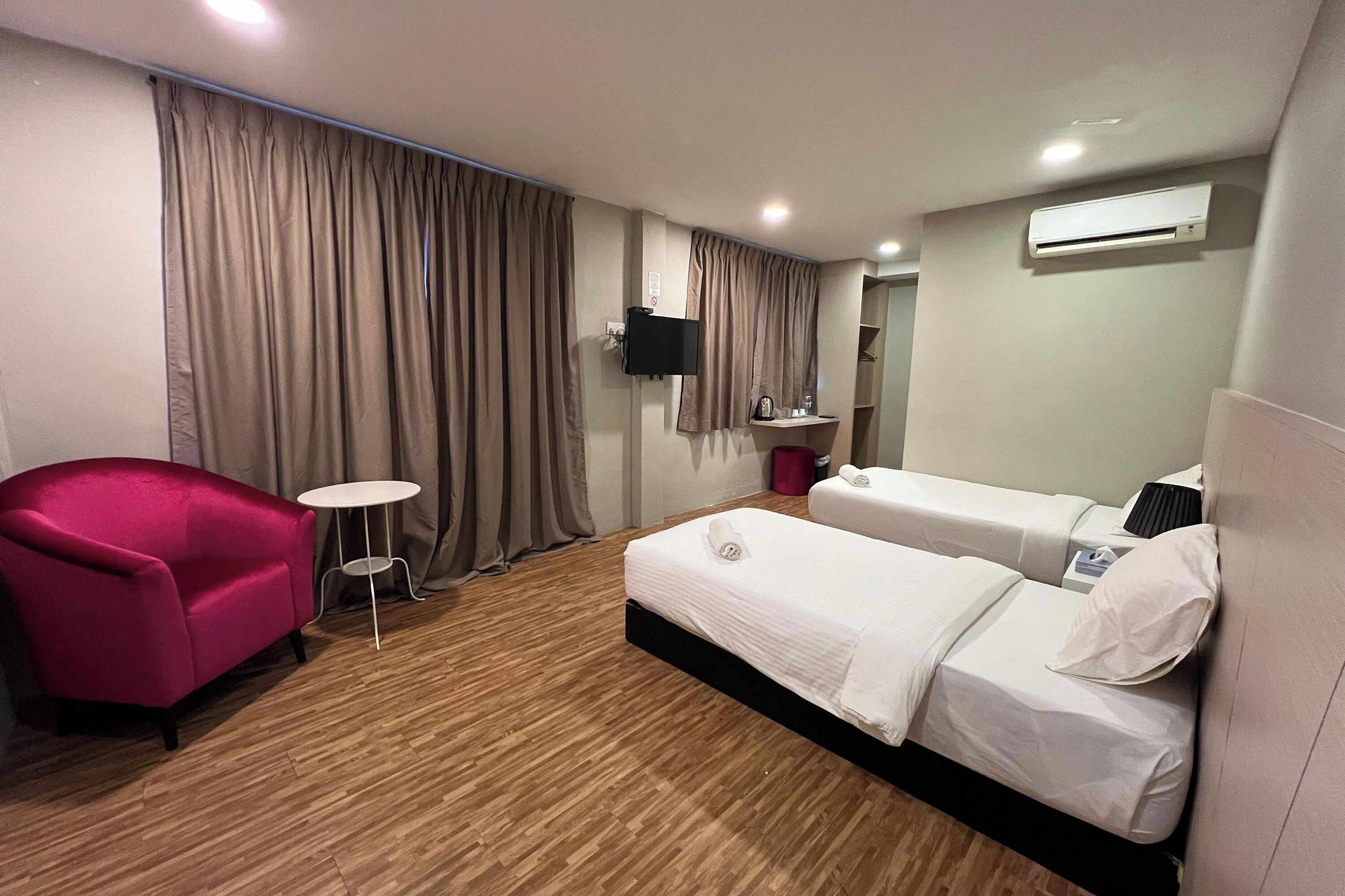 deluxe twin room | desk, laptop workspace, blackout curtains, iron/ironing board