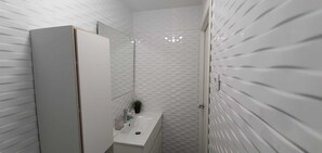 Shower, free toiletries, hair dryer, slippers