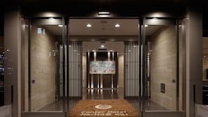 An elevator entrance with a digital display and a doormat reading "Center Hotel Narita 2 R51". - Center Hotel Narita 2 R51 (Narita)