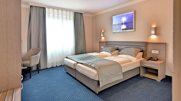 Hypo-allergenic bedding, in-room safe, desk, laptop workspace