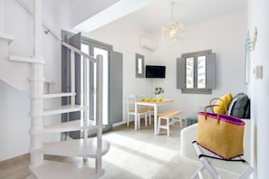 Junior Suite, Hot Tub, Sea View | Living area | Flat-screen TV - White Harmony Suites (Santorini)